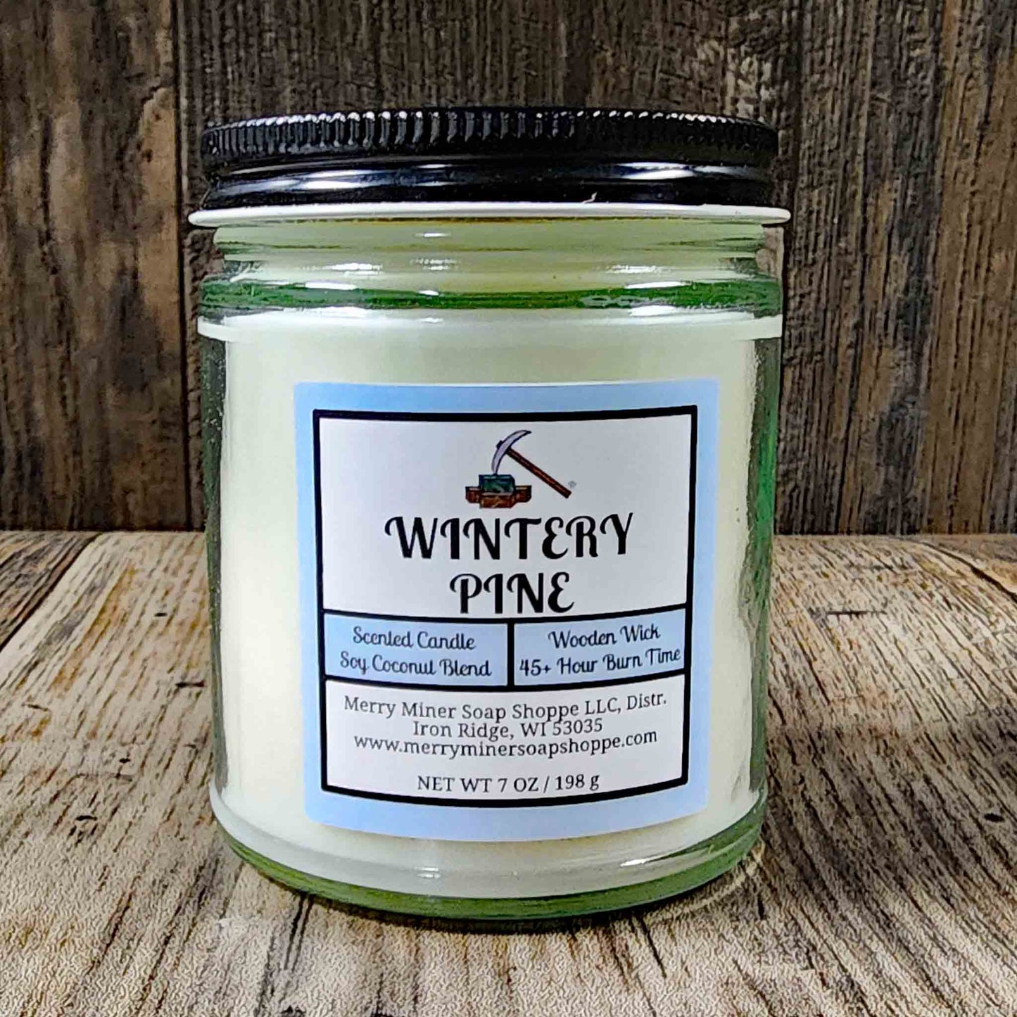 soy coconut wax candle with wooden wick scented as wintery pine